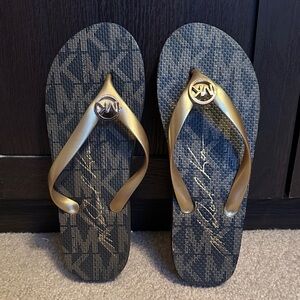Michael Kors Black and Gold Flip Flops
